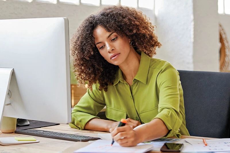 A woman looking at small business information
