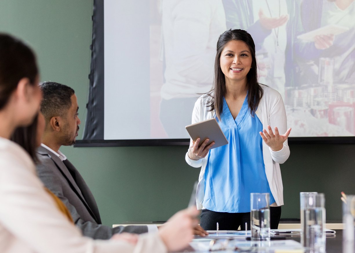 A woman conducting a meeting in a conference room