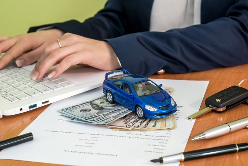 A client researching loans on the laptop