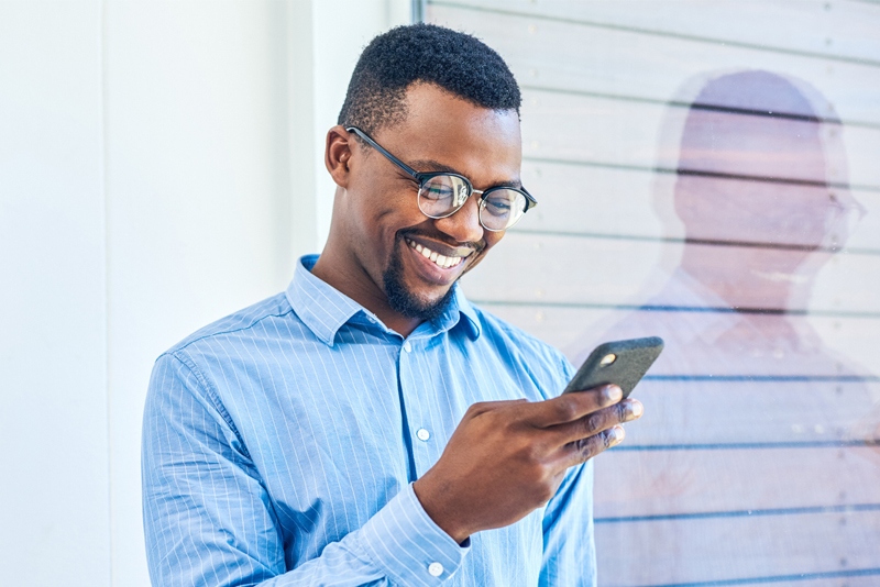 A consumer looking at his phone