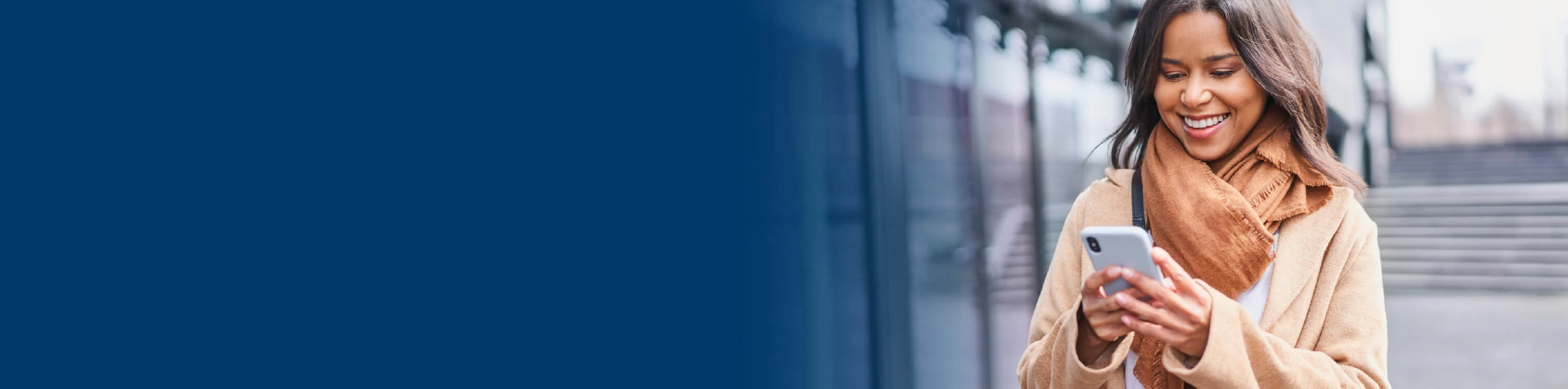 A woman looking at her mobile device