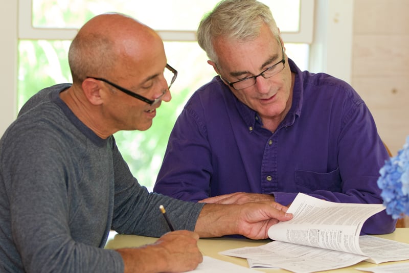 Two people looking at their financial income