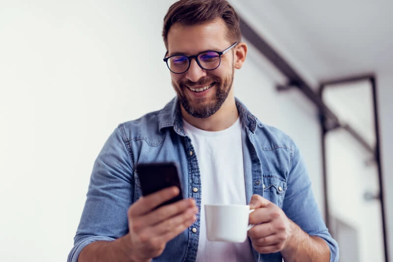 A man reading documents on his mobile device