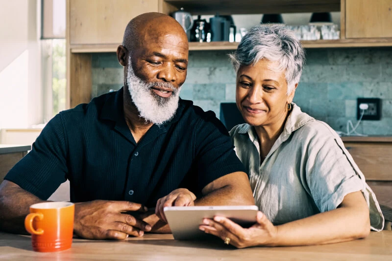 A couple looking at merger information