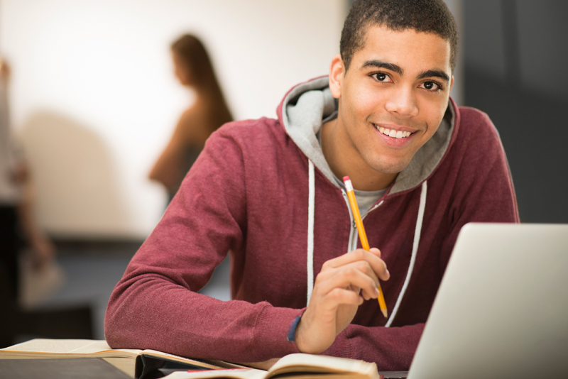 A student working on his laptop