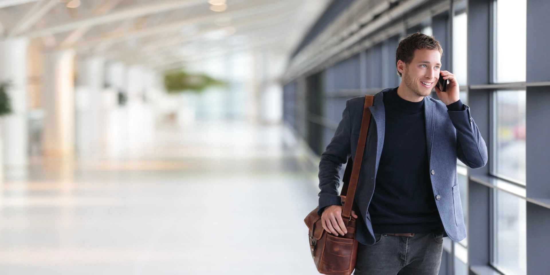 A man on his phone talking with a family member