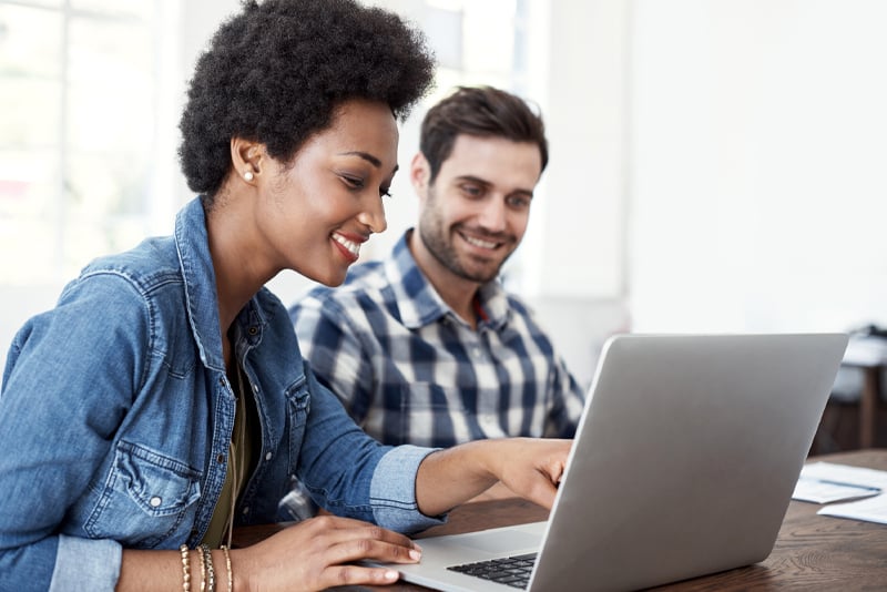 Clients looking at their laptop reviewing the guidelines