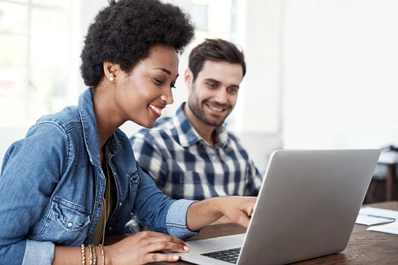 Clients looking at their laptop reviewing the guidelines