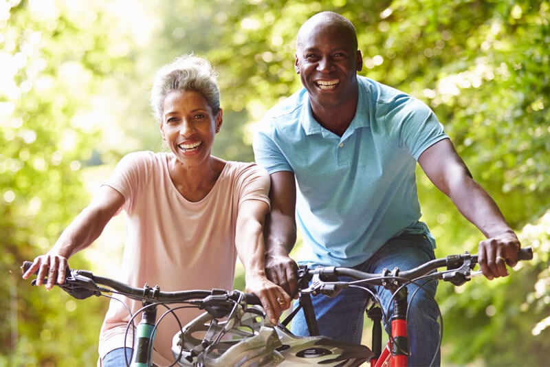 A couple out on a bike ride enjoying the weather