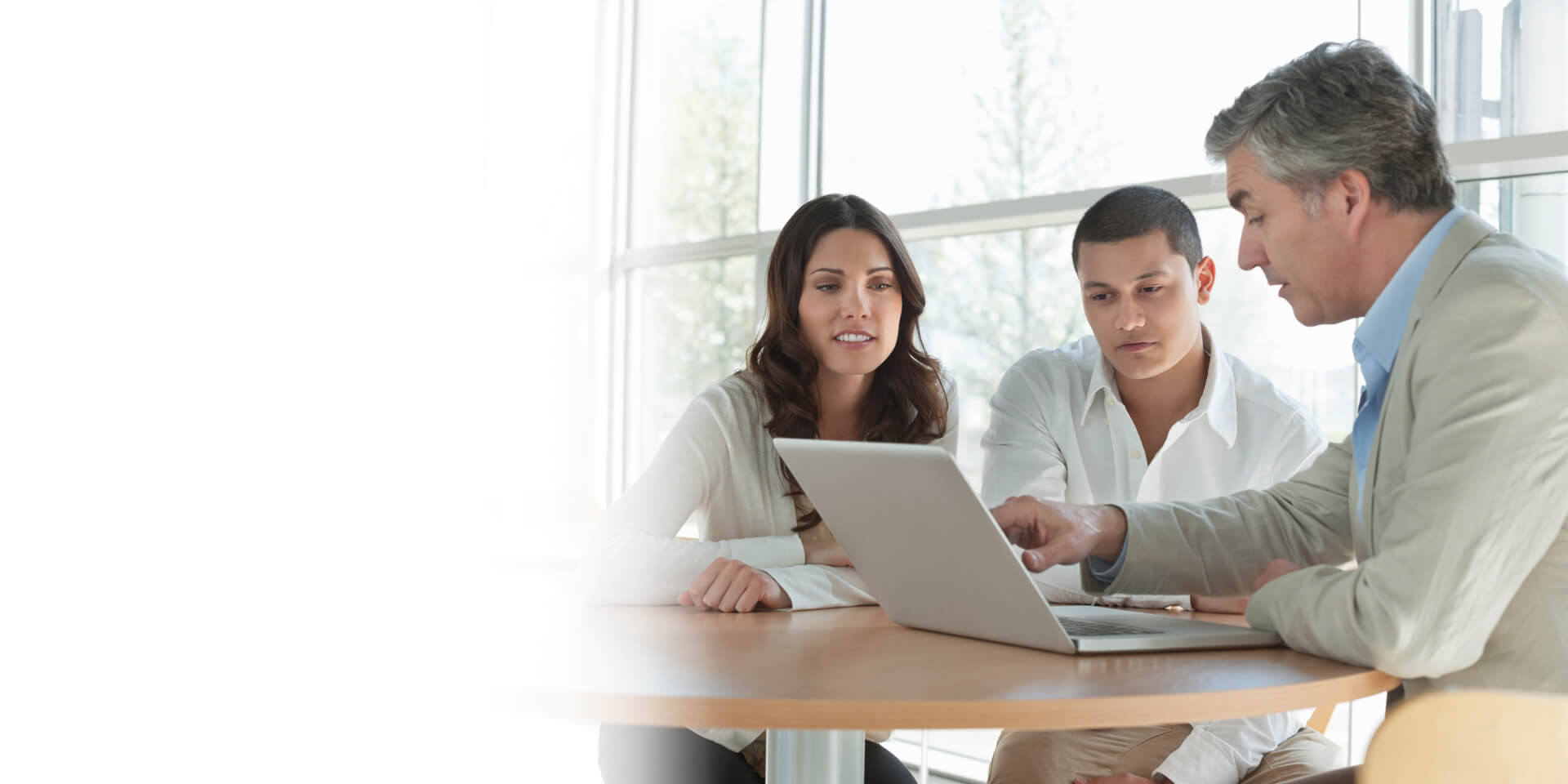 A young couple talking with their banker