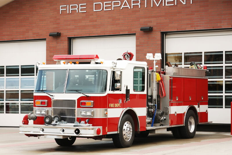 A firetruck parked at the firehouse