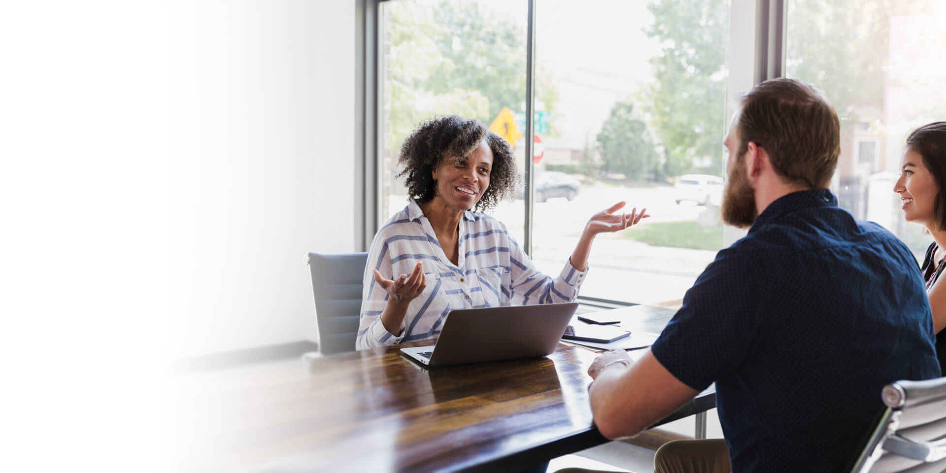 A banker having a meeting with her client at a local branch