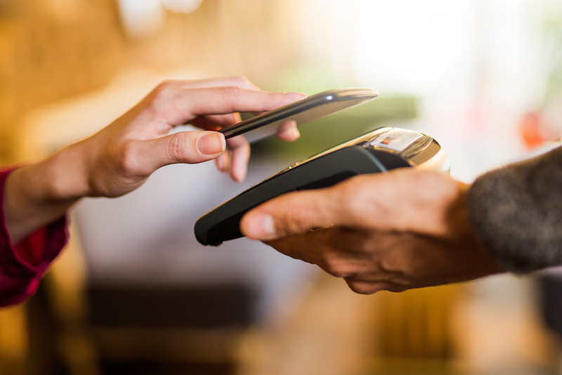 A client paying by her mobile device