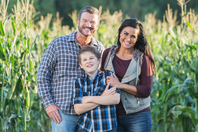 A family of farmers out in their field