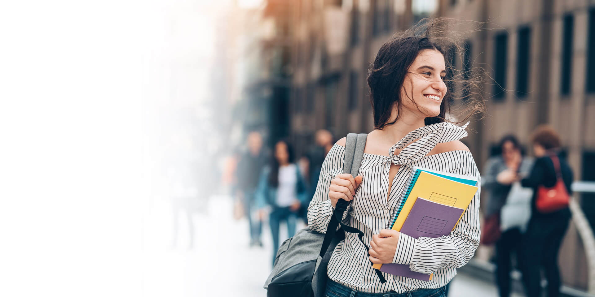 A young professional walking to her next class