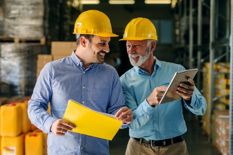 A group of colleagues looking at plans