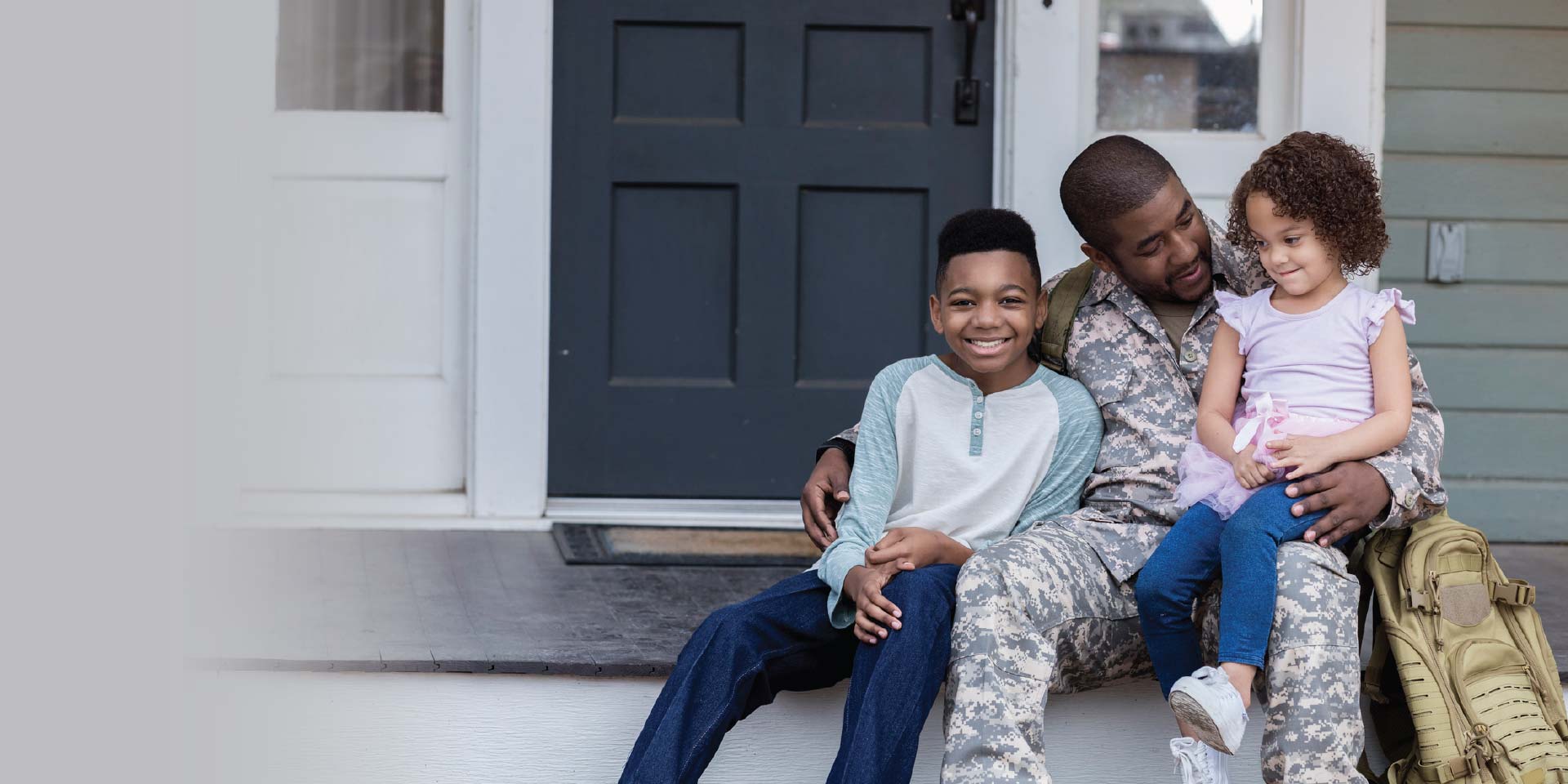A military soldier home with his kids