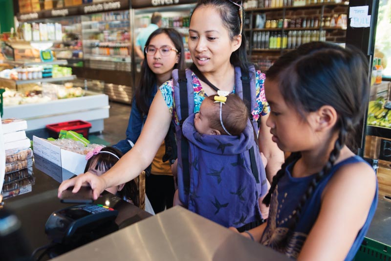 A shopper paying via a digital payment