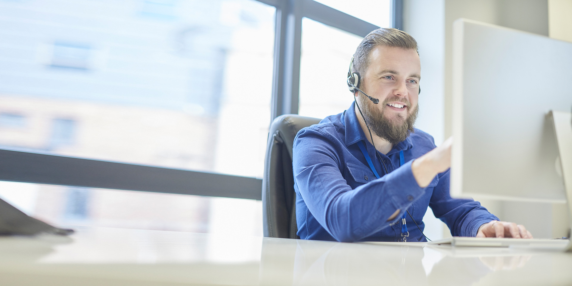 A customer service associate on a call with a client