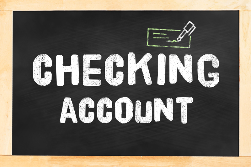Checking account written on a chalkboard
