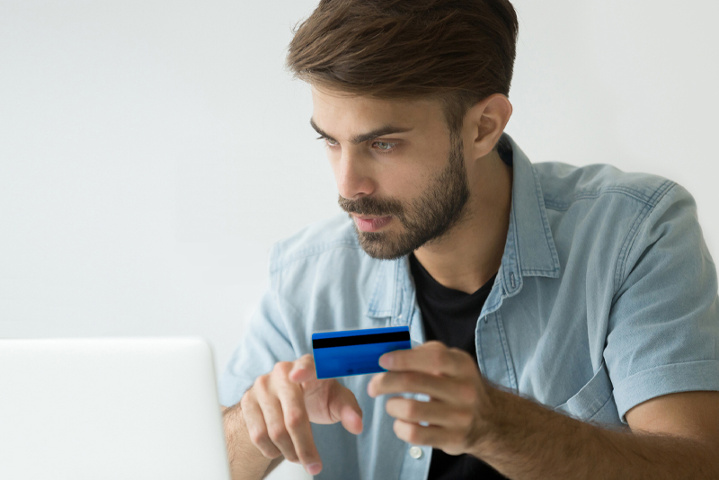 A man making an online purchase with his credit card
